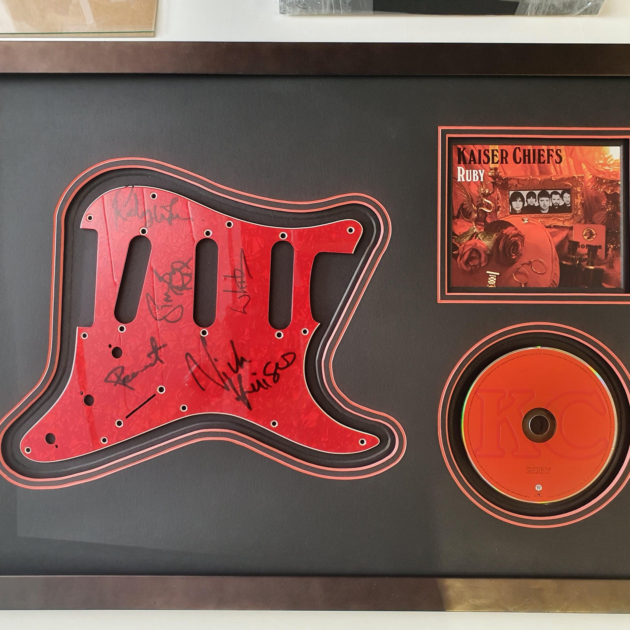 Kaiser Chiefs Signed Guitar Scratch Plate Framed. - Darling Picture Framing